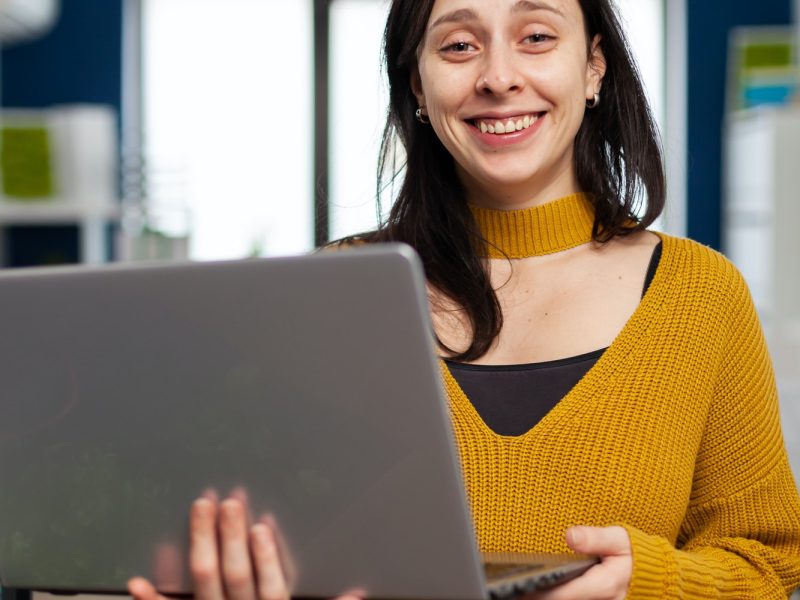 woman-retoucher-looking-at-camera-smiling-working-in-creative-media-agency.jpg